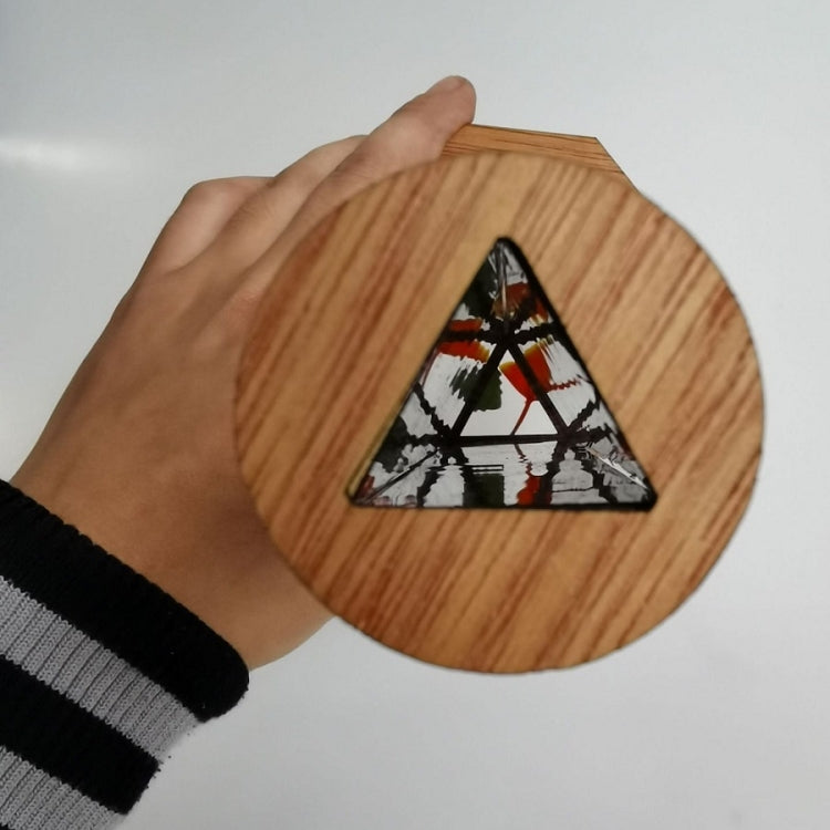 Wooden kaleidoscope toy with octagon lens window and mountain-style image insert