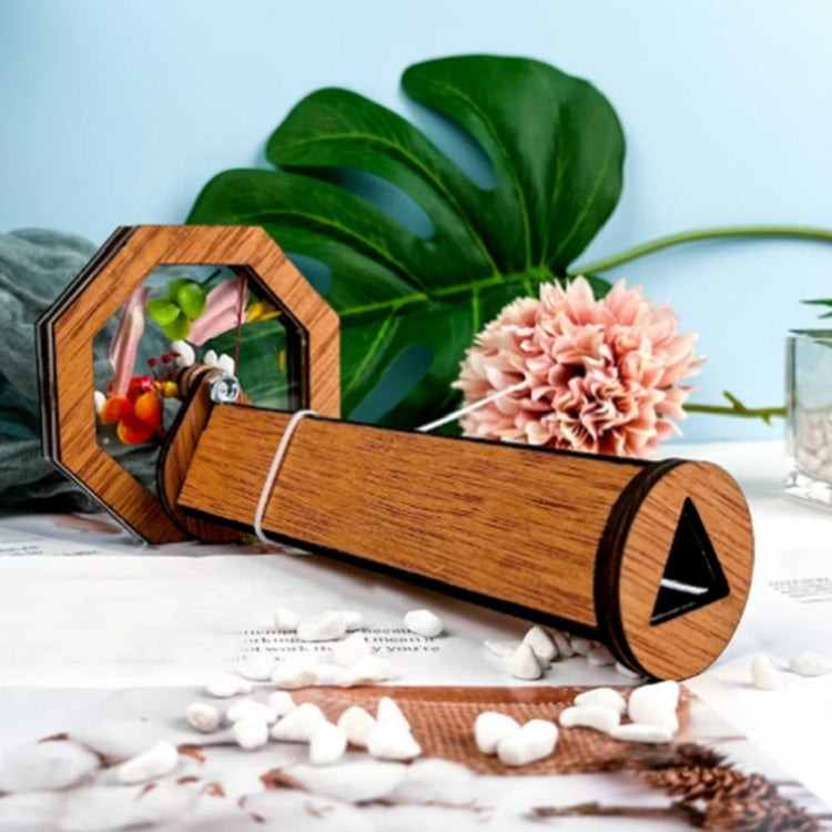 Wooden kaleidoscope toy with octagon window and side tube, on tabletop