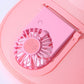 Close-up pink sunshade fan hat showing built-in fan grille inside the brim