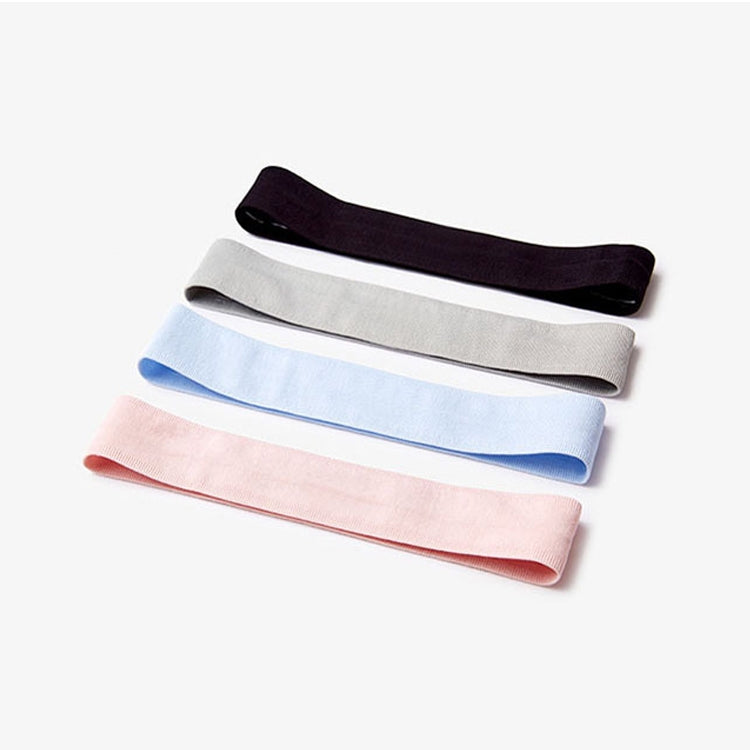 Silicone non-slip running headbands stacked in black, gray, blue, and pink