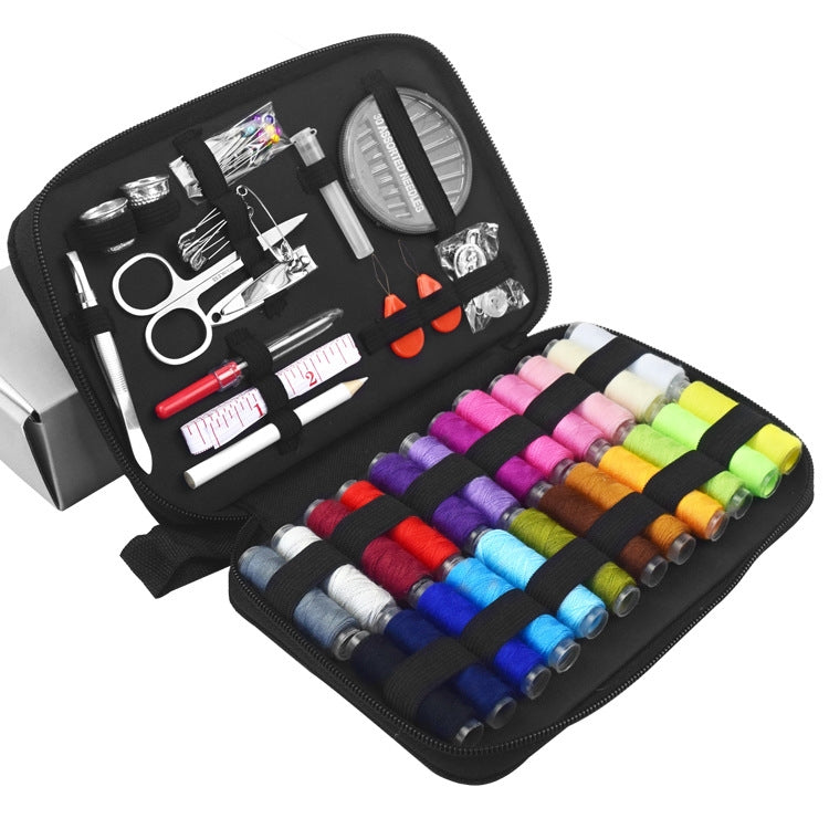 Open sewing kit case with multi-color thread spools and various sewing tools inside