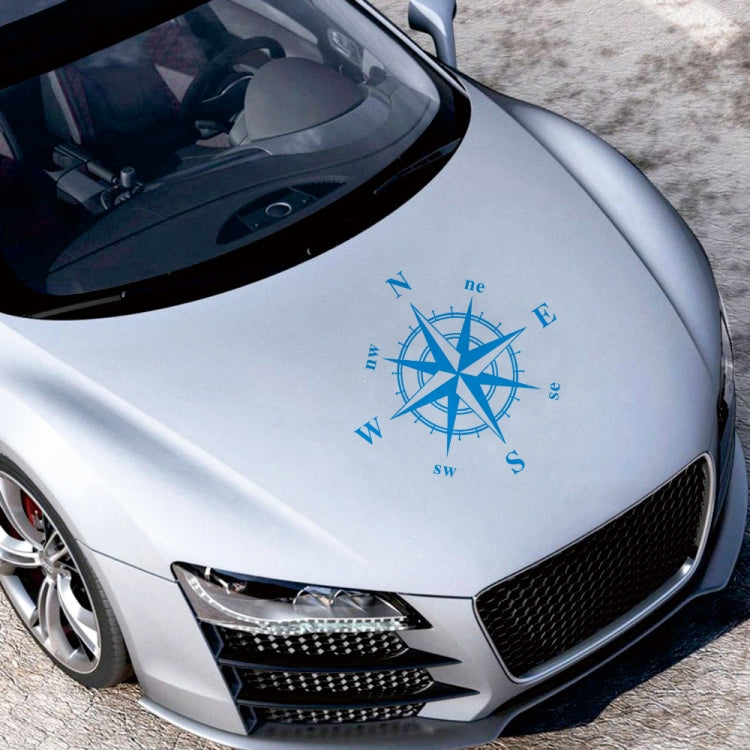 Blue compass rose graphic car sticker centered on a car hood
