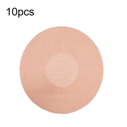 Round beige fabric adhesive patch with a circular center