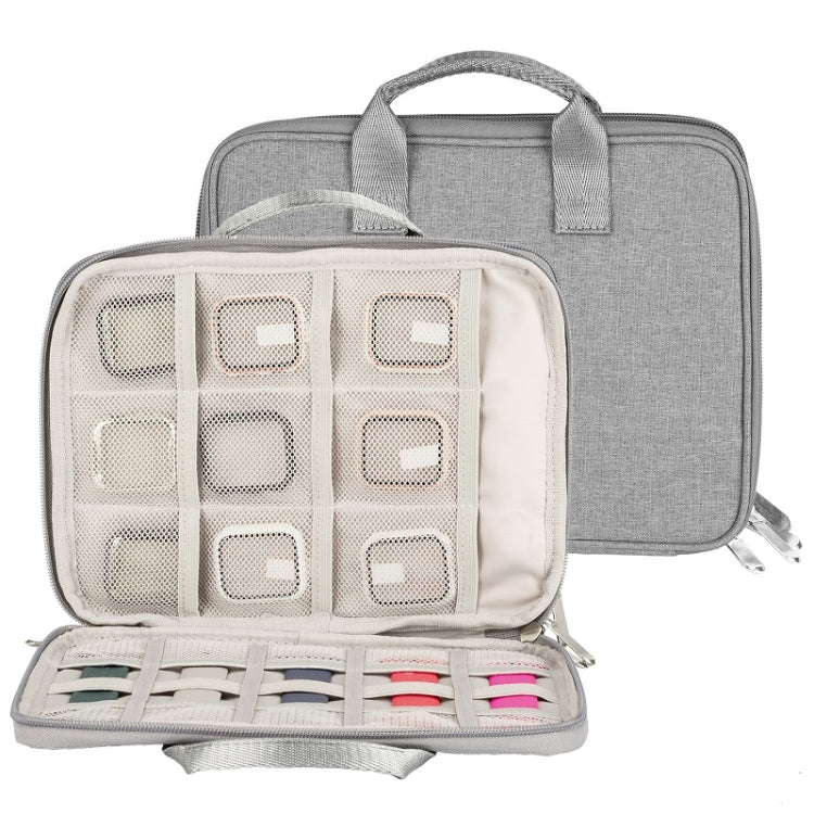 Grey double-layer cable organizer bag open to show grid storage compartments