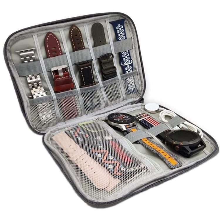 Open grey cable storage organizer with elastic slots and small compartment grid