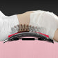 Adjustable massage board under white back support, showing black spike panel