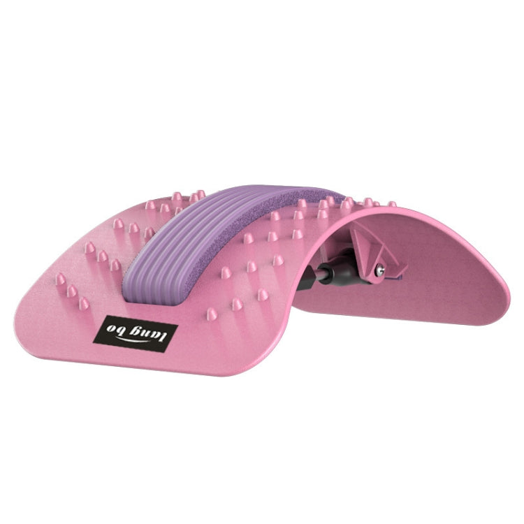 Rotary massage board with pink ridged roller and white acupressure spikes on gray base