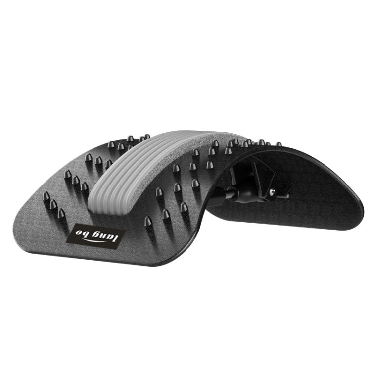 Rotary massage board with gray ridged roller and black acupressure spikes on dark base