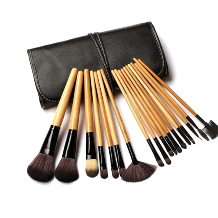 Makeup brush set with soft bristle heads, wood handles, and black fold-over case