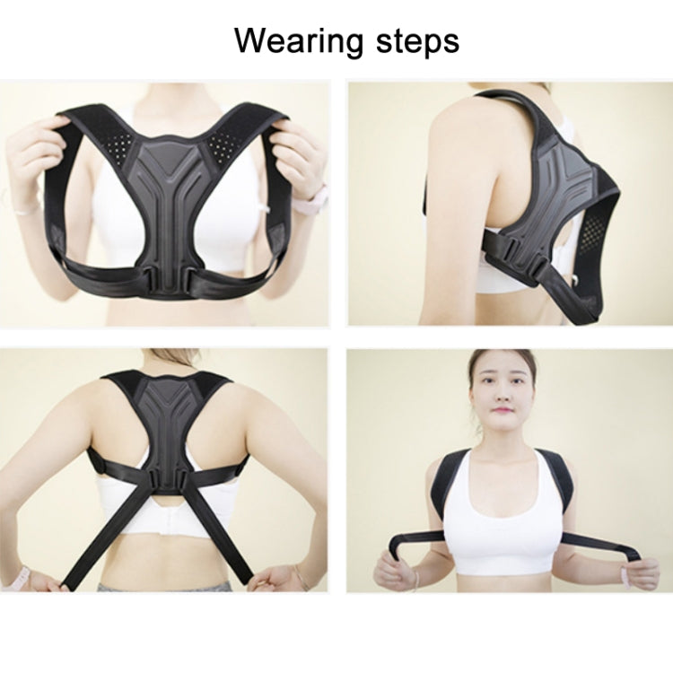 Black Y-back posture correction belt with adjustable shoulder straps, shown being worn