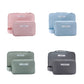 Pastel cosmetic storage bag set in pink, blue, sage, and charcoal, each zippered