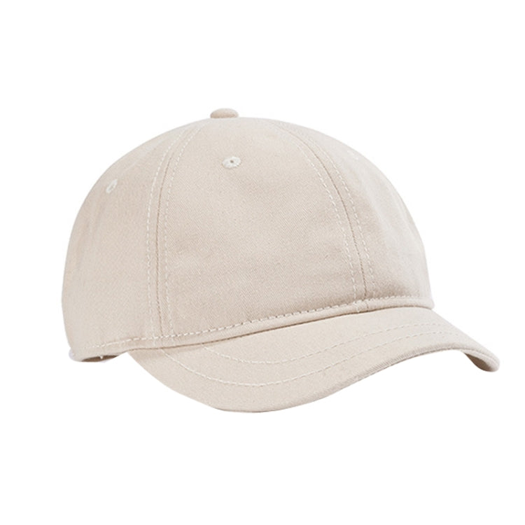 Beige white baseball cap with short curved brim and stitched crown panels