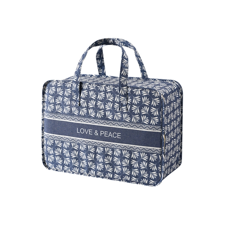 Blue leaf-pattern fabric organizer bag with top handles and front “LOVE & PEACE” label