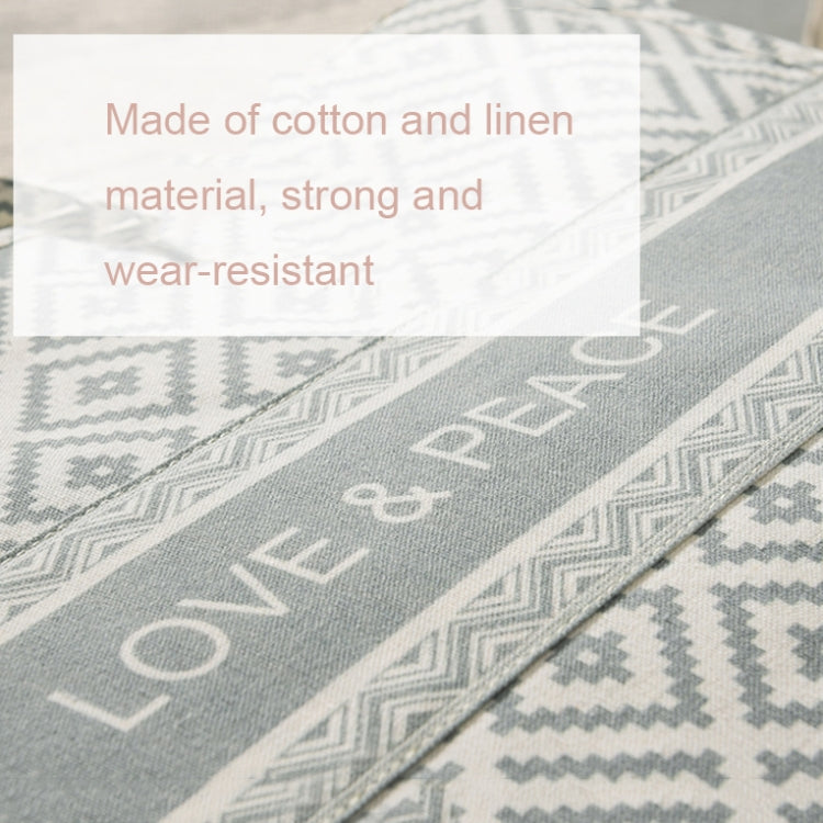 Close-up of gray patterned fabric panel with diamond and border print