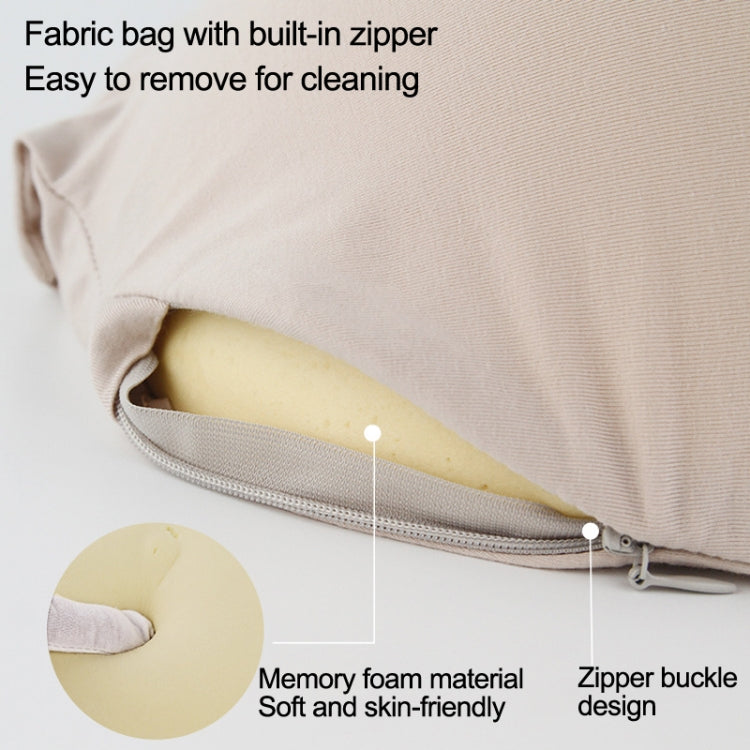 Light beige memory foam belly prop with zippered fabric cover and buckle strap detail