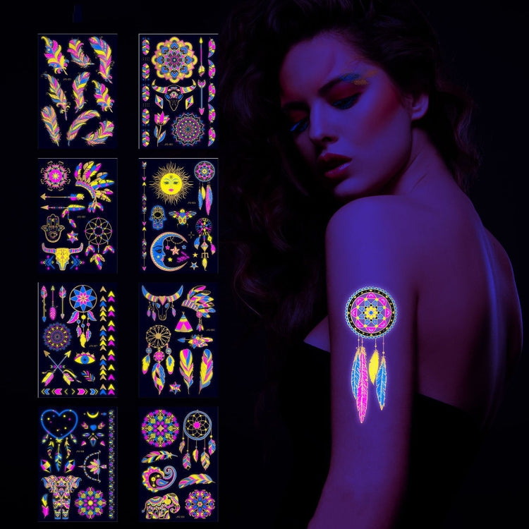 Fluorescent tattoo sticker set with dreamcatcher motifs shown on skin under blacklight