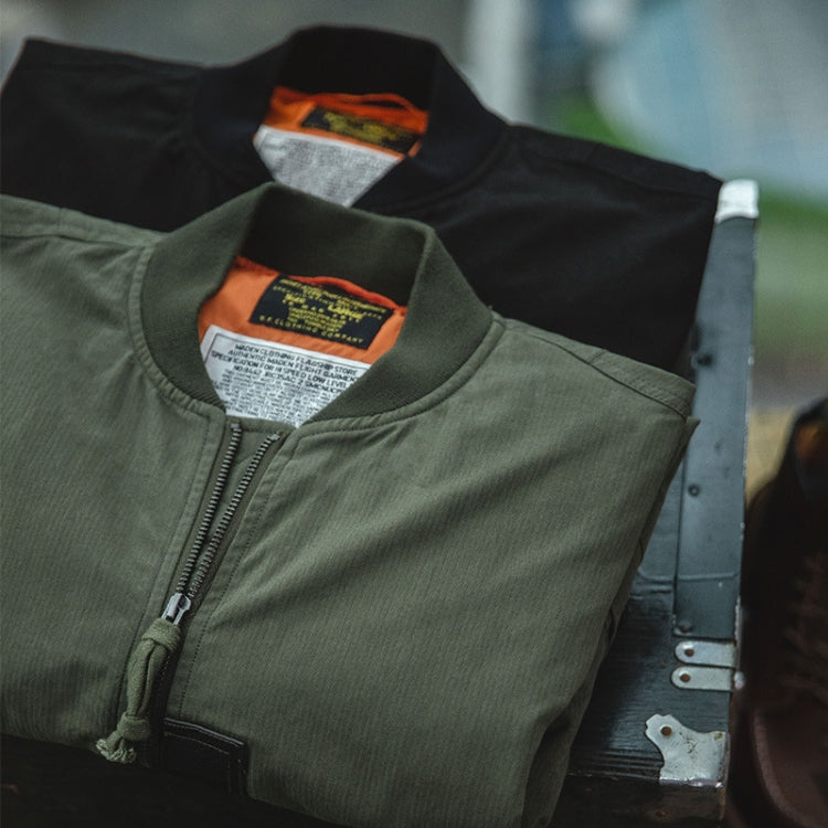 Olive bomber jacket front with zip-up placket and ribbed cuffs