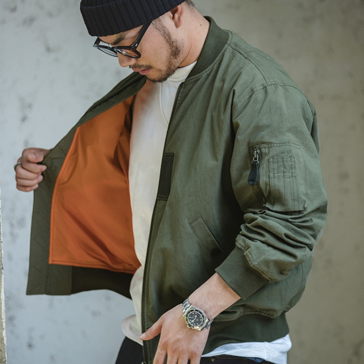 Green bomber jacket with orange inner lining, zip front, and ribbed collar