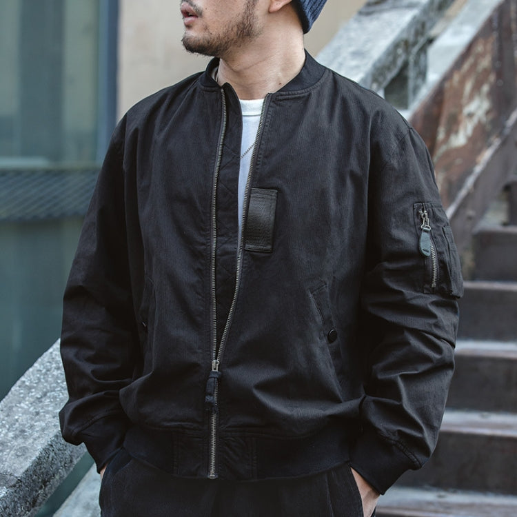 Black bomber jacket with standing collar, zip front, and rectangular chest pocket detail