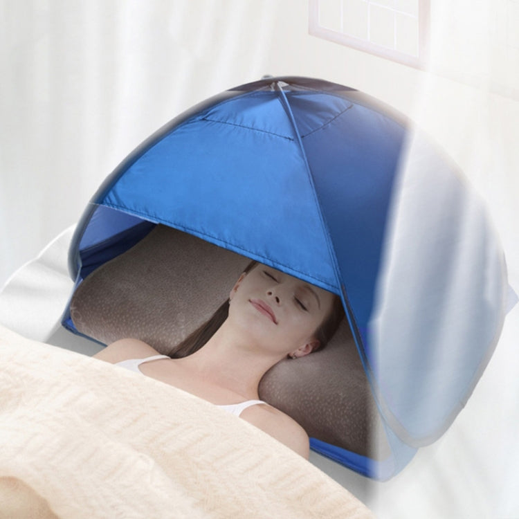 Blue pop-up sunshade tent covering a person resting on a bed