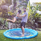 Family playing on blue sprinkler play mat with water spray outdoors