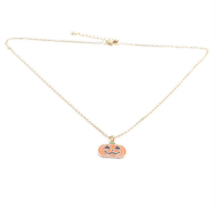 Gold-tone chain necklace with a single orange jack-o’-lantern pumpkin pendant