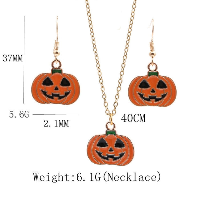 Halloween jewelry set: gold-tone necklace with three pumpkin pendants and matching earrings