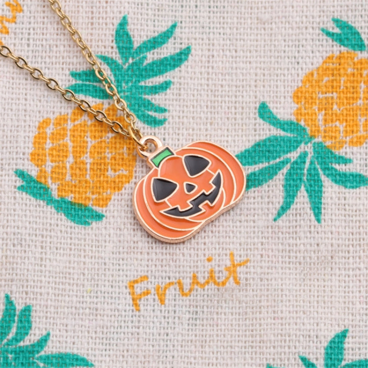 Orange jack-o’-lantern pumpkin pendant charm with black face on gold-tone chain