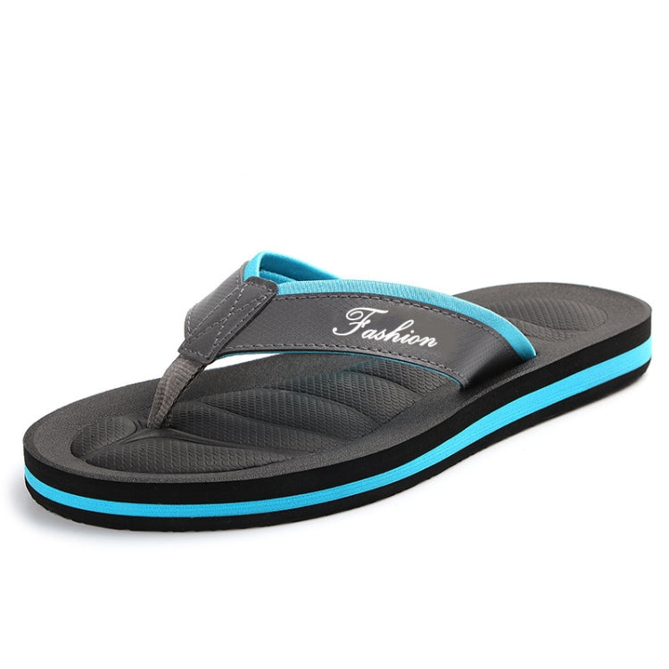 Men's black flip flops with blue trim, contoured footbed, textured tread sole