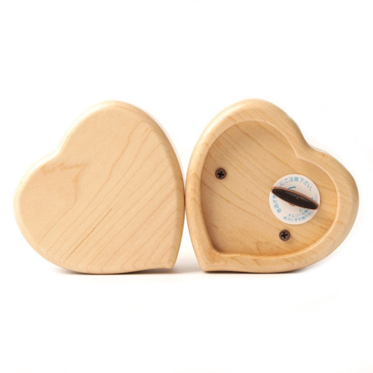 Light heart-shaped wooden music box with back panel and mounting screws, two angles