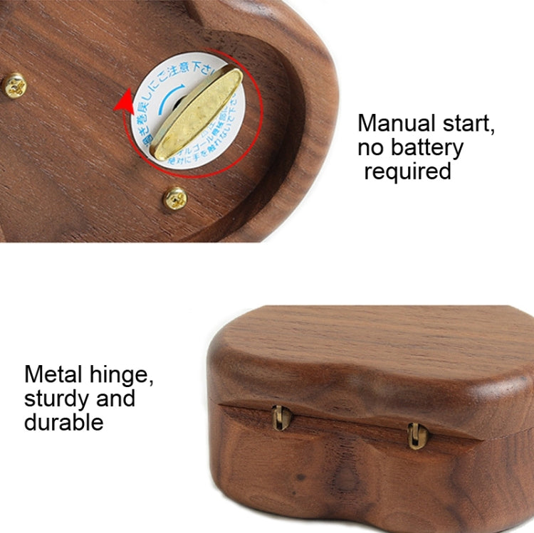 Walnut heart-shaped wooden base with metal hinge and visible starter button area