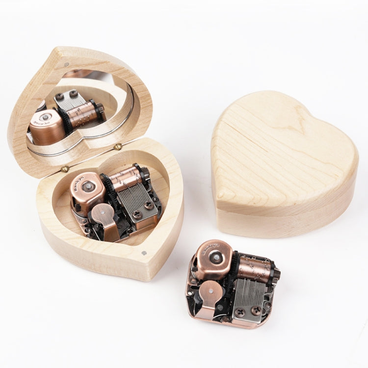 Light heart-shaped wooden music box with mirror lid and copper-tone music mechanism, open