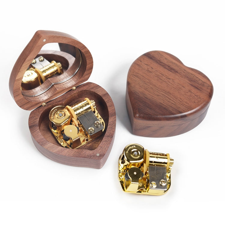 Dark heart-shaped wooden music box with mirror lid, gold-tone mechanism, open and closed