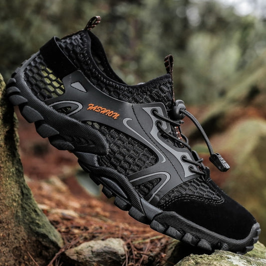 Black outdoor wading sandal shoe, side profile, lace-up with textured tread outsole.