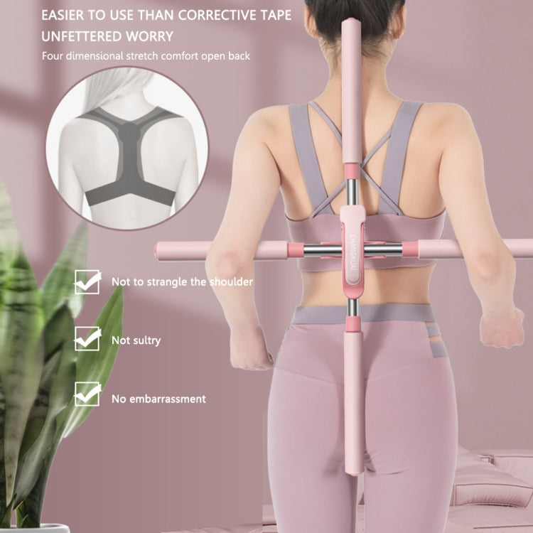Open-shoulder posture corrector worn on back with padded vertical support stick