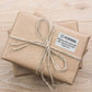 Wrapped kraft gift with warning sealing sticker, 40x60mm, tied with twine
