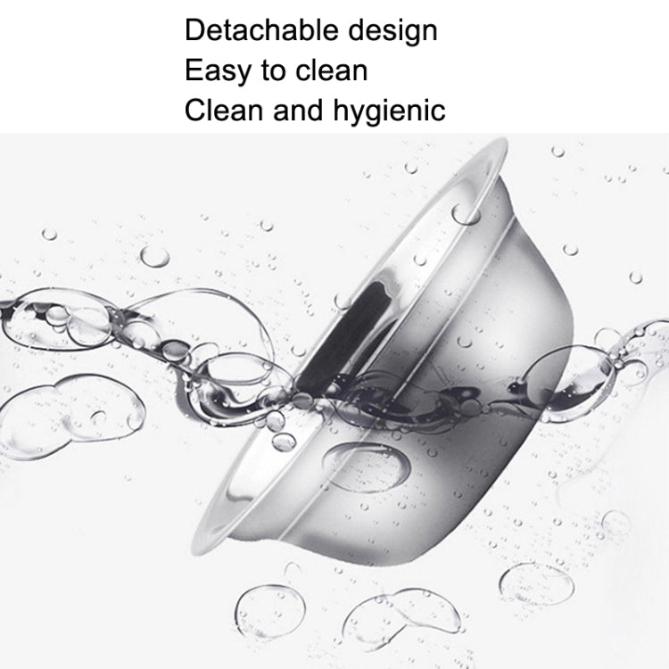 Stainless steel pet bowl on light-colored base with water droplets