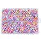 Kids DIY beaded jewelry kit with pastel acrylic beads and decorative pieces in a tray