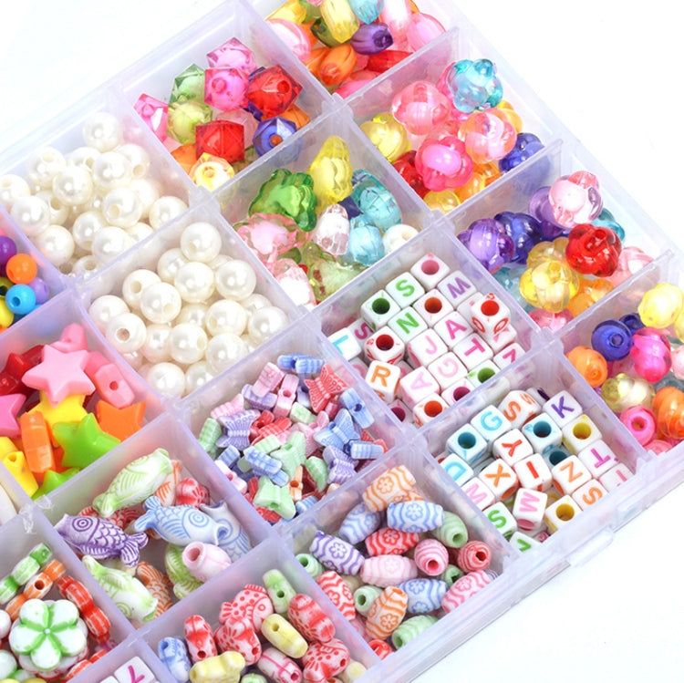 Assorted colorful plastic beads, pearl beads, and letter beads in compartment tray