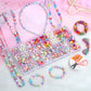 Beaded bracelets and headband with charms, plus organized bead tray