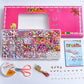 DIY bead jewelry kit in pink case with bead compartments, scissors, strings, and charms