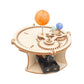 Wooden astronomy planet experiment kit showing gear platform, orange sun, blue planets