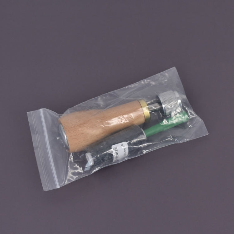 Leather stitching tool in clear plastic packaging with wooden handle and metal tip