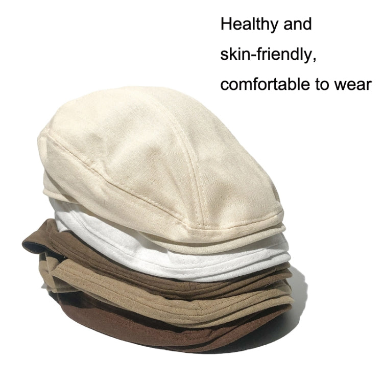 Stack of linen beret-style caps in cream, white, and brown colors