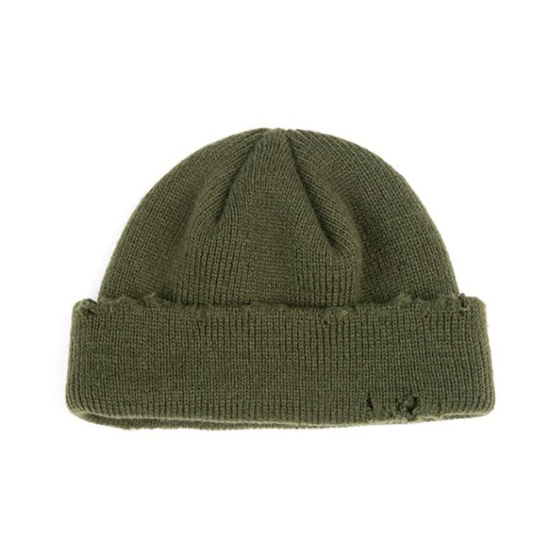 Green ribbed knit beanie hat with cuff and small distressed frayed spots