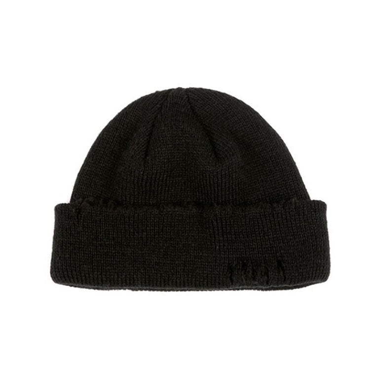 Black ribbed knit beanie hat with cuff and small distressed frayed spots
