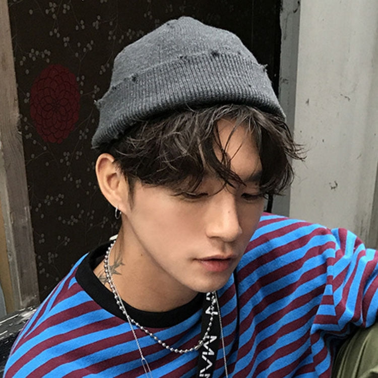 Grey knit beanie hat worn low with ribbed cuff