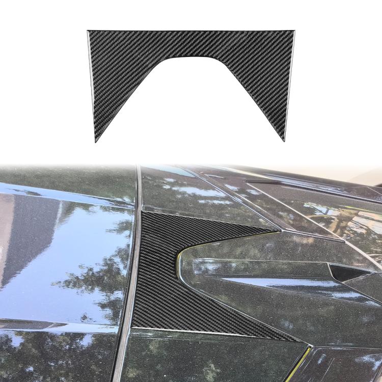 Black carbon-fiber roof decoration sticker installed on vehicle panel