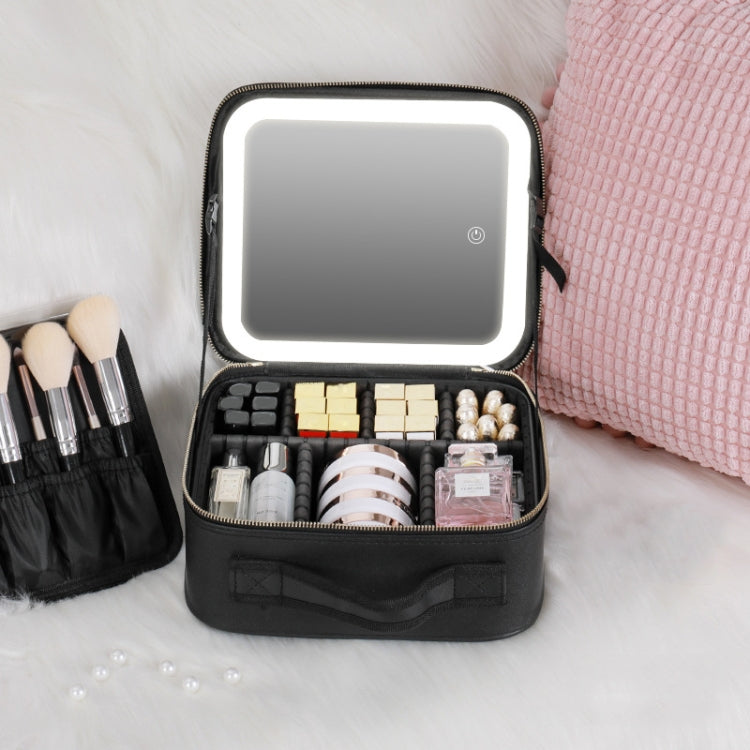 Black makeup bag with built-in LED lamp, open organizer with bottles, brushes, and compacts