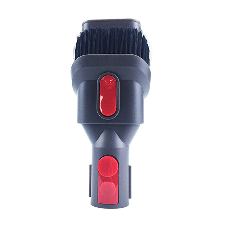 Rotating vacuum brush attachment with dark bristles and two red switch buttons.